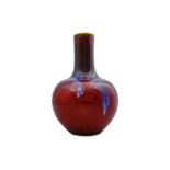 A CHINESE FLAMBE-GLAZED BOTTLE VASE.