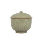 A CHINESE CELADON-GLAZED 'LOTUS PETAL' JAR AND COVER.