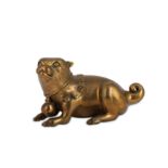 A BRONZE FIGURE OF A SEATED DOG.