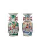 † A PAIR OF CHINESE FAMILLE ROSE FIGURATIVE VASES.