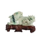 A CHINESE APPLE-GREEN JADEITE CARVING OF A QILIN.