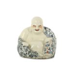 A CHINESE PORCELAIN FIGURE OF BUDAI HESHANG.