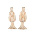 A PAIR OF CHINESE POTTERY FIGURES OF SERVANTS.