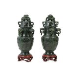 A PAIR OF CHINESE SPINACH JADE 'DRAGON' VASES AND COVERS.