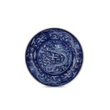 † A CHINESE BLUE AND WHITE 'DRAGON' DISH.