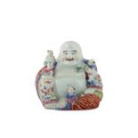 A CHINESE FAMILLE ROSE FIGURE OF BUDAI HESHANG WITH FIVE BOYS.