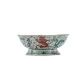 A CHINESE FAMILLE ROSE LOBED 'NINE DRAGONS' STEM BOWL.