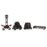 SIX CHINESE CIRCULAR WOOD STANDS, A RECTANGULAR STAND ANS A PLATE STAND.