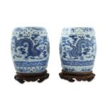 A PAIR OF BLUE AND WHITE MINIATURE GARDEN SEATS.