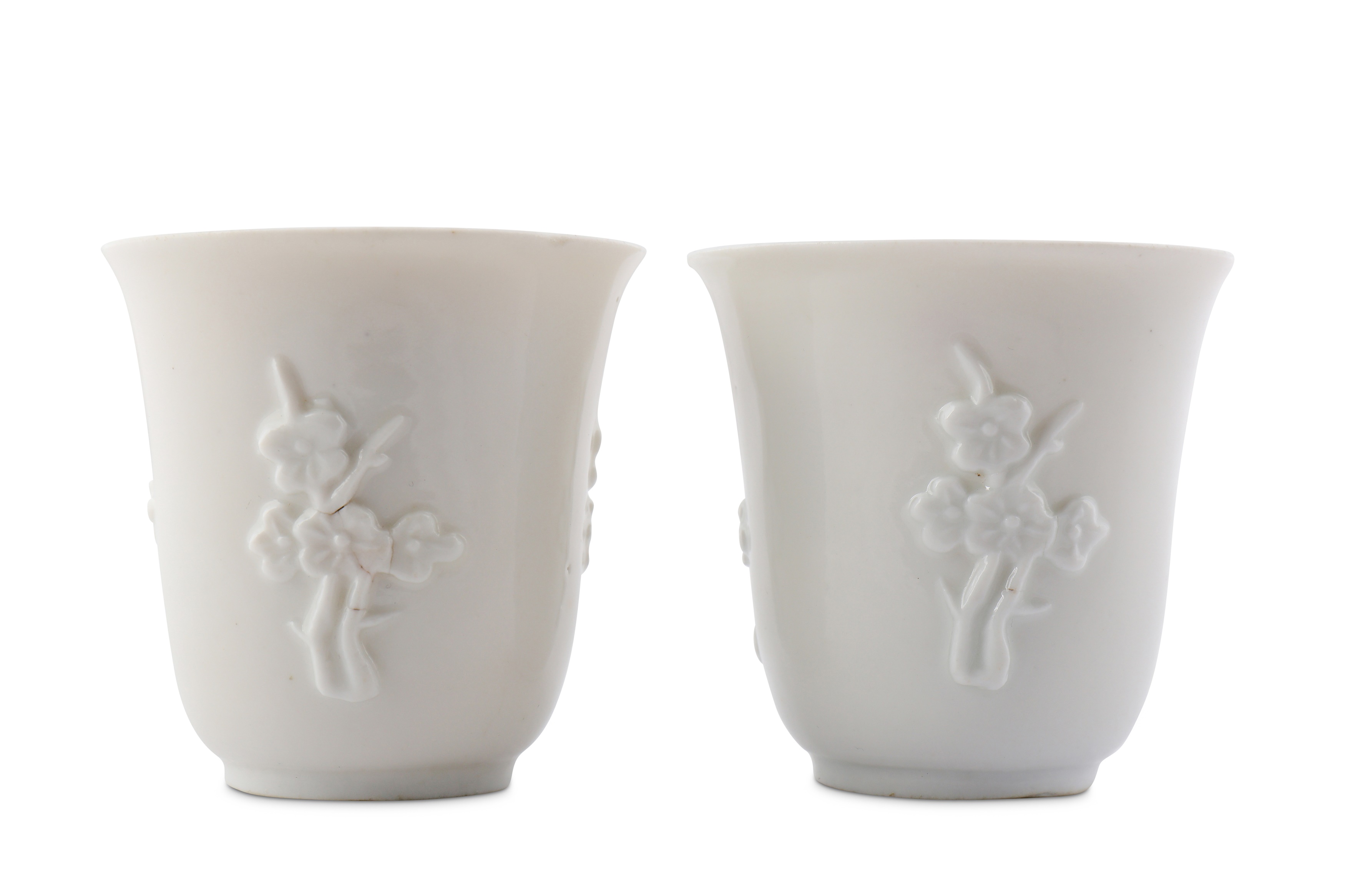 A PAIR OF CHINESE BLANC-DE-CHINE 'PRUNUS' CUPS.