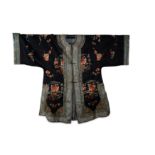 A CHINESE DARK BLUE-GROUND EMBROIDERED SILK LADY'S JACKET.