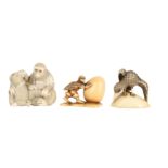 λ THREE JAPANESE IVORY NETSUKE.