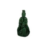 A CHINESE GREEN STONE FIGURE OF GUANYIN WITH A BOY.