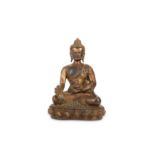 A CHINESE GILT-BRONZE MEDICINE BUDDHA.