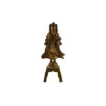 A GILT-BRONZE STANDING FIGURE.