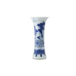 A CHINESE BLUE AND WHITE 'IMMORTALS' TRUMPET VASE.