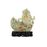 A CHINESE PALE CELADON JADE ‘DOUBLE DRAGON FISH' CARVING.