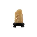 A CHINESE YELLOW JADE CARVING OF A BAMBOO SHOOT.