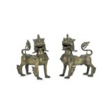 A PAIR OF BRONZE LION DOG GUARDIANS.