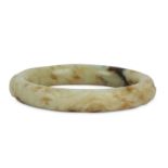 A CHINESE PALE CELADON JADE BANGLE.