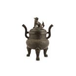 A BRONZE BUDDHIST LION DOG TRIPOD INCENSE BURNER.