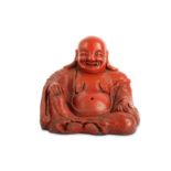 A CHINESE CINNABAR LACQUER FIGURE OF BUDAI HESHANG.