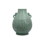 A LARGE CHINESE SLIP-DECORATED CELADON VASE, HU.