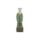 A CHINESE FAMILLE VERTE FIGURE OF A SAGE.