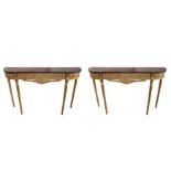 A pair of Adam style console tables,