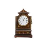 An English Regency brass inlaid mahogany mantle timepiece / clock