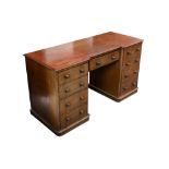 A Victorian mahogany inverted breakfront twin pedestal desk,