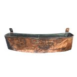 A 19th Century shaped and hand planished copper wall mounted planter or trough,