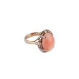 A coral and diamond ring