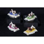 Four Staffordshire parti-coloured poodles, circa 1835-50