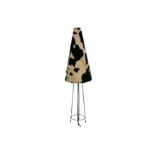 A contemporary cow hide table lamp