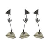 Three contemporary pressed glass pendant lights by Tom Dixon