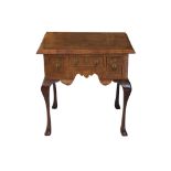 An early 20th century walnut lowboy in the Queen Anne style