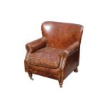 A Victorian style brown leather upholstered armchair,