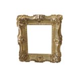 A LOUIS XV, PART CARVED AND COMPOSITION SWEPT FRAME