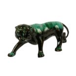 A large contemporary ceramic green glaze lion figure