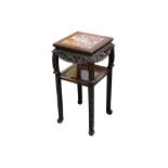 A 19th Century Chinese carved hardwood jardiniere stand