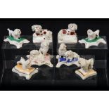 A collection of eight Staffordshire toy poodle groups