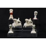 A collection of Staffordshire porcelain poodles, circa 1820-50