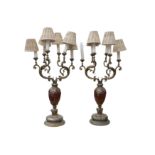 A pair of gilt metal mounted marble six light candelabra in the Rococo style