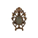 A small 19th Century oval mirror