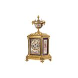 A THIRD QUARTER 19TH CENTURY FRENCH NAPOLEON III GILT BRONZE AND SERVES PORCELAIN MANTEL CLOCK