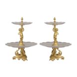 A PAIR OF EARLY 20TH CENTURY GILT BRONZE AND CUT GLASS TWO-TIER SURTOUT DE TABLE OR TABLE