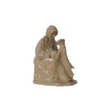 AN EARLY 20TH CENTURY GLAZED EARTHENWARE FIGURE OF AN ELDERLY LADY ATTRIBUTED TO MARY BUCHANAN