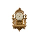 A 19TH CENTURY AND LATER SWEDISH GILTWOOD WALL CLOCK IN THE EMPIRE STYLE