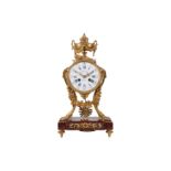 A LAST QUARTER 19TH CENTURY FRENCH ORMOLU AND RED GRIOTTE MARBLE MANTLE CLOCK BY FERDINAND